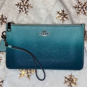 Blue ombré double zip Coach wristlet.
